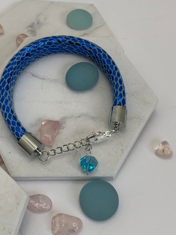 7" Blue Snakeskin Print Bracelet with Adjustable Clasp and Blue Crystal Charm